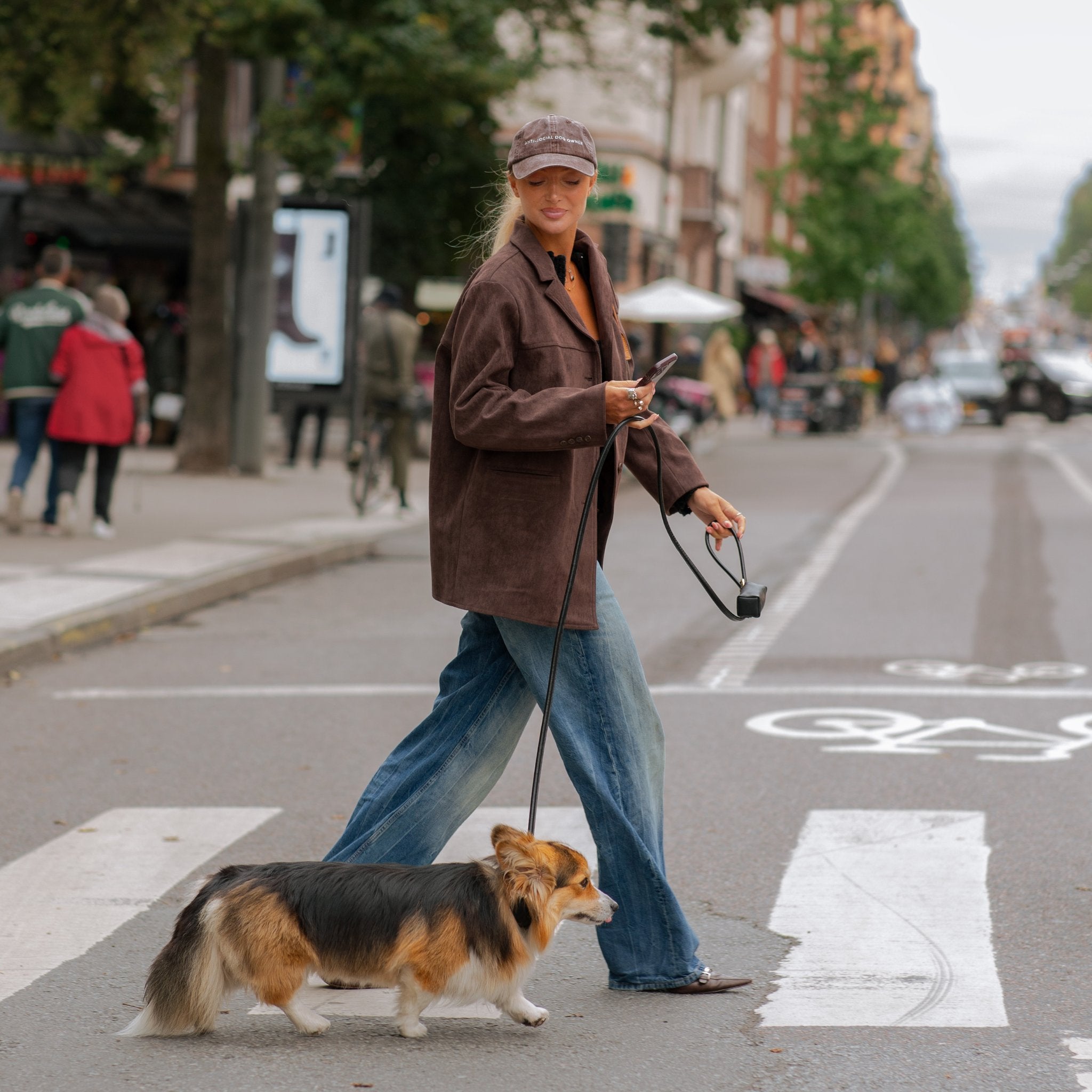 brown-denim-cap-anti-social-dog-owner-woman-corgi.jpg