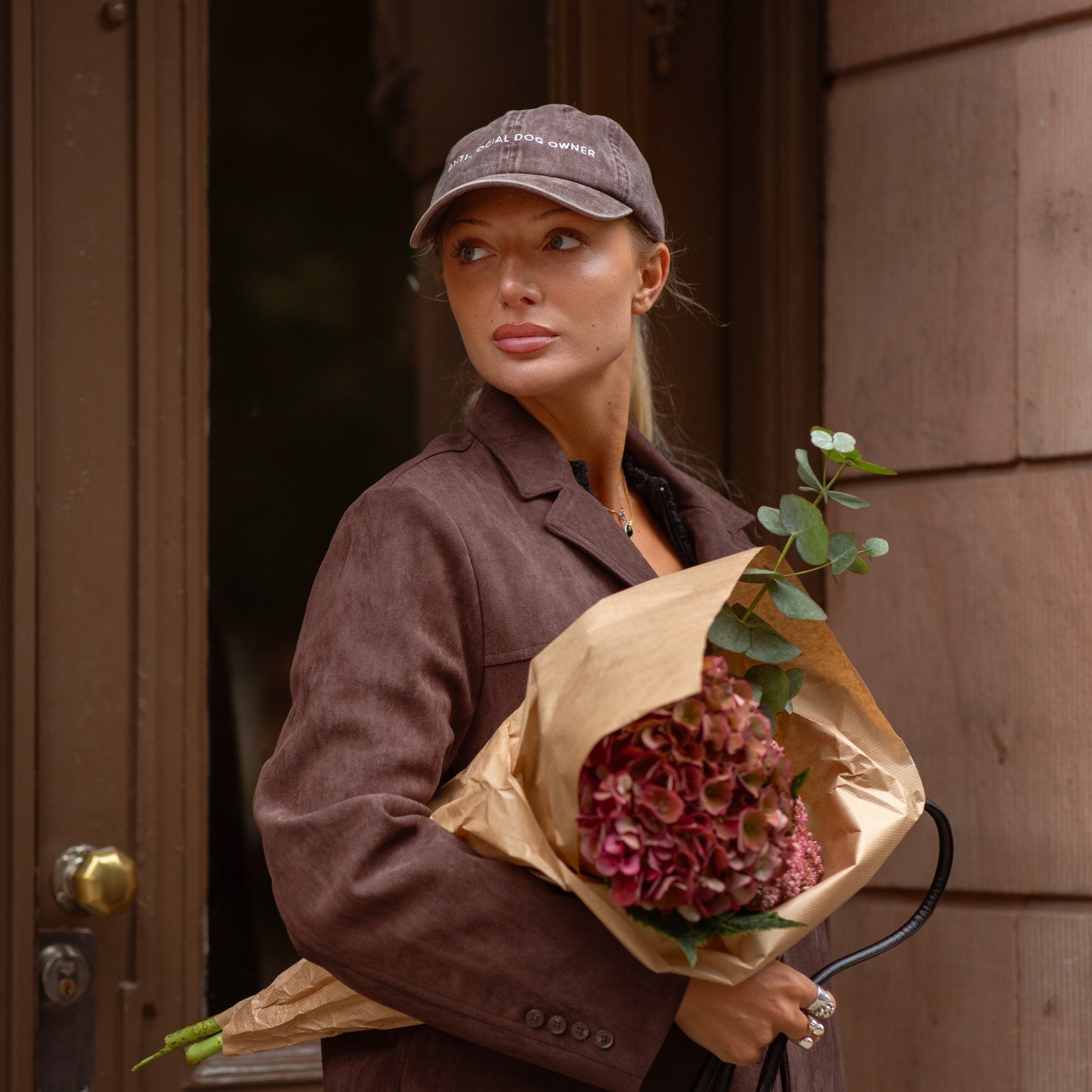 brown-denim-cap-anti-social-dog-owner-woman-flower.jpg